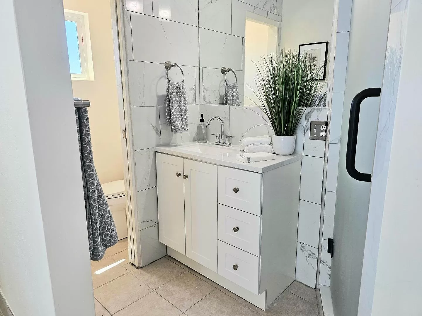 New primary bath with walk-in shower.
