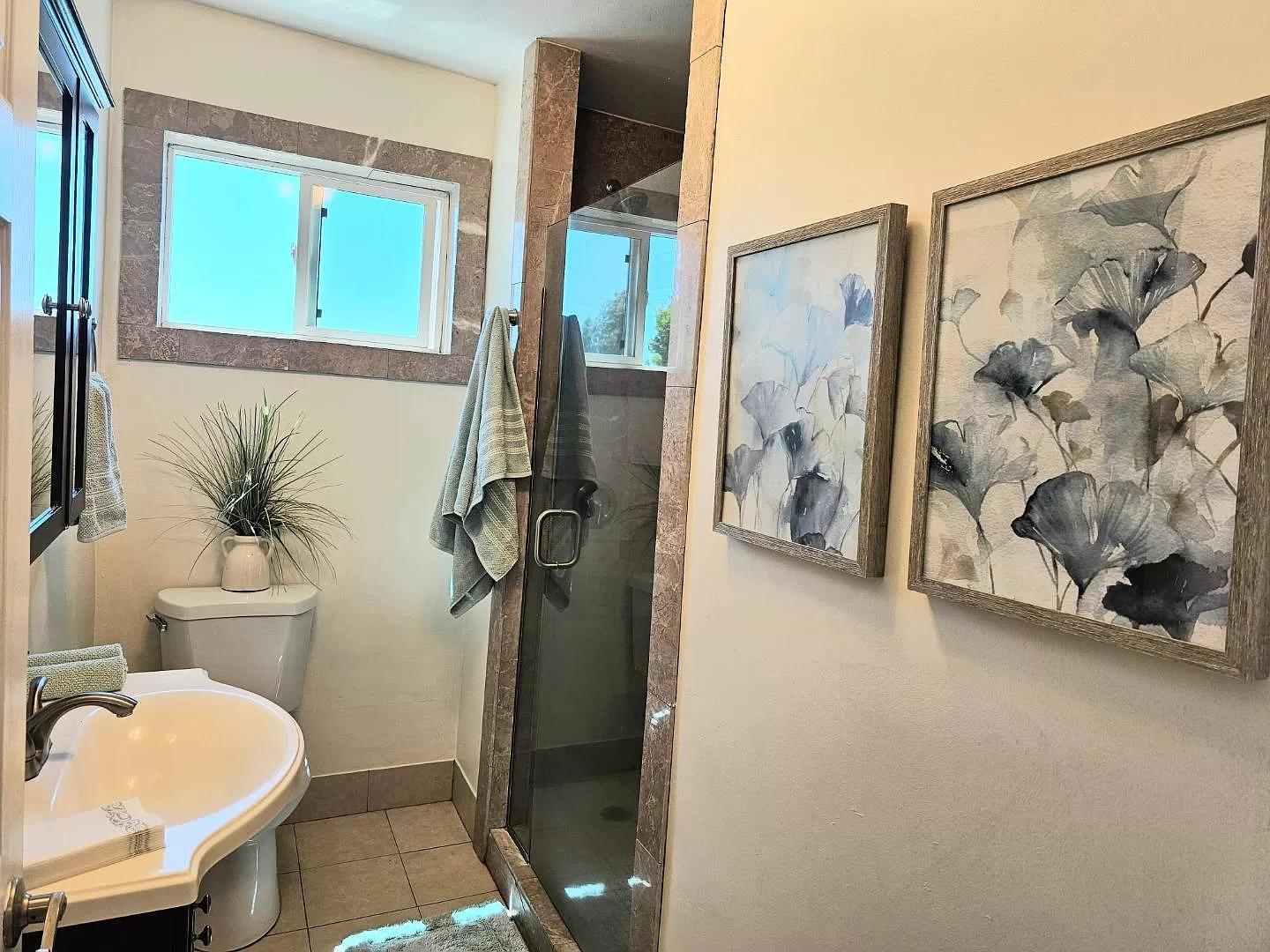Hall bath with marble shower.
