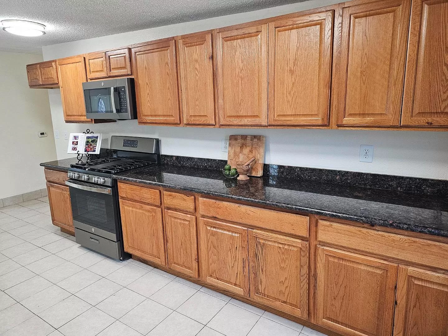 Kitchen: lots of storage, new stove & microwave, granite counters.