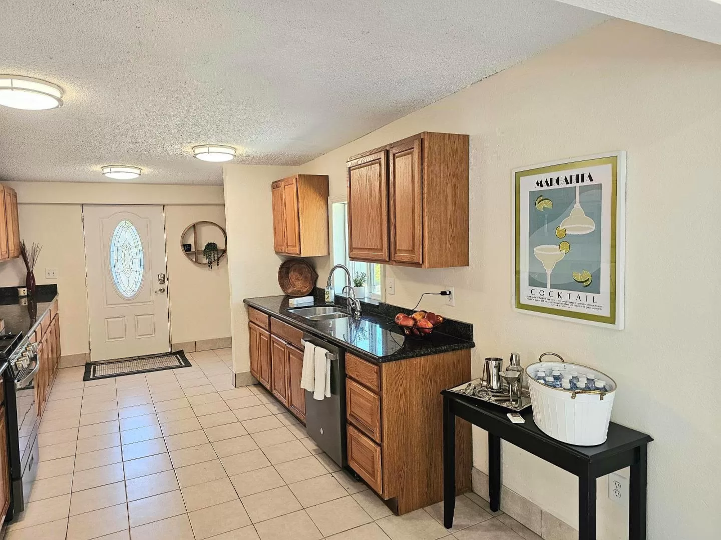 Kitchen with new dishwasher and space for a table.