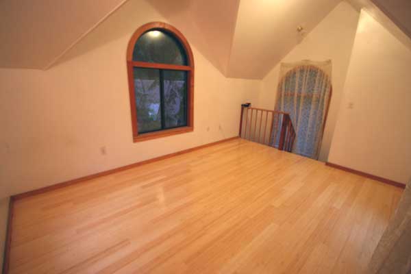 Spiral steps to lower floor at far end.