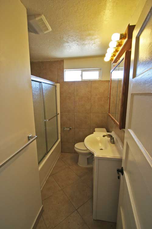 Remodeled bath with tub & shower doors; updated wiring & lighting.