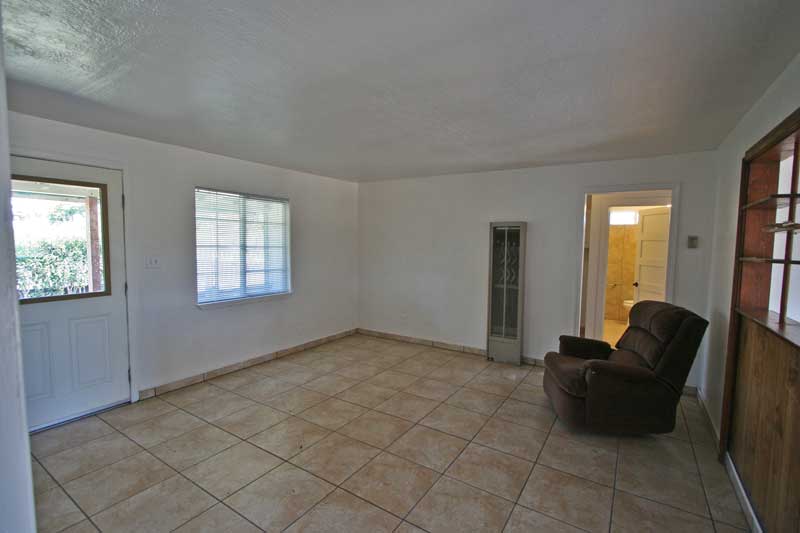 Entry to tiled living area from front porch.