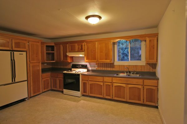 Large eat-in kitchen with plentiful storage.
