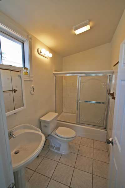 Tile bathroom with updated fixtures.