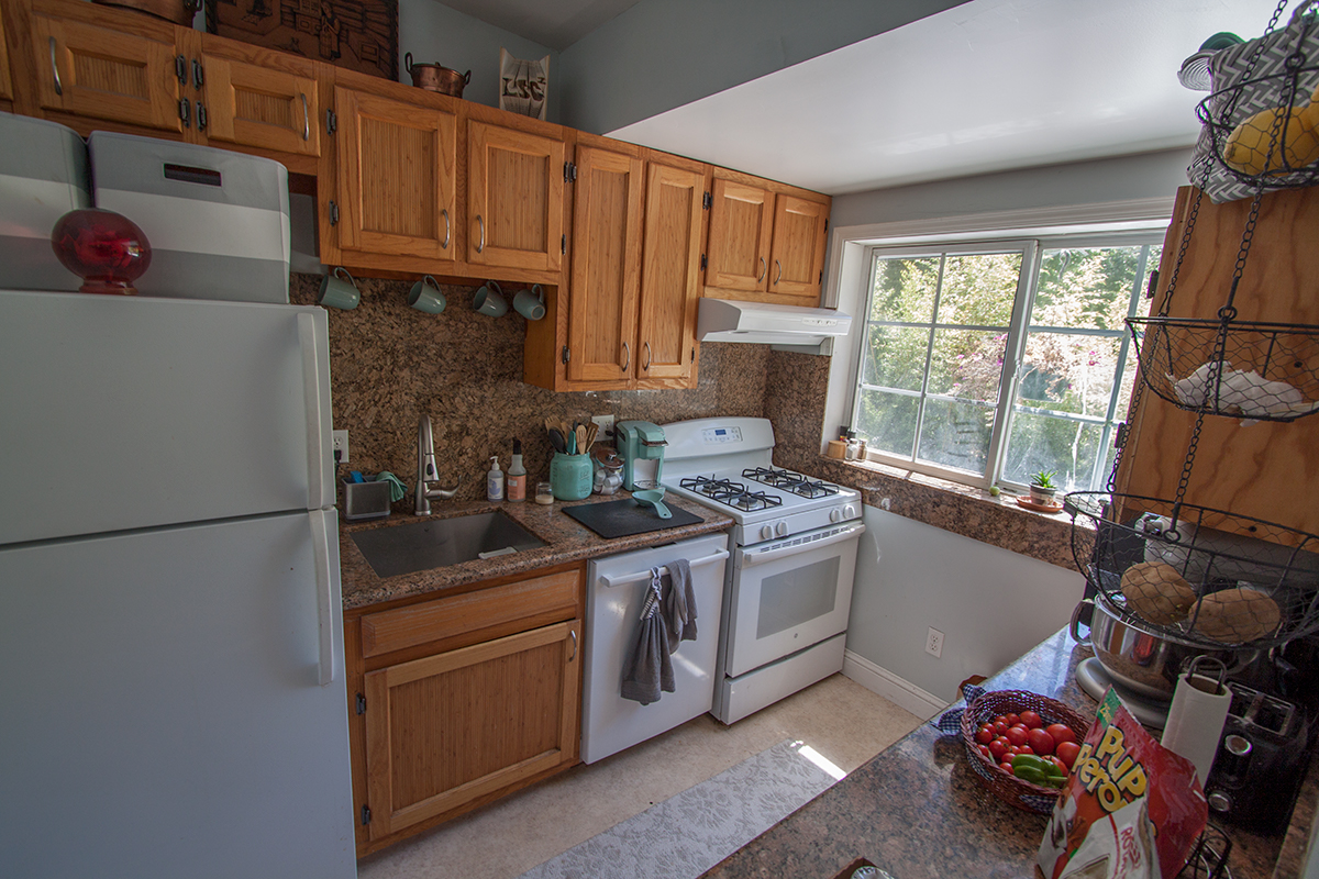Upstairs kitchen: custom oak cabinets, granite, great view.