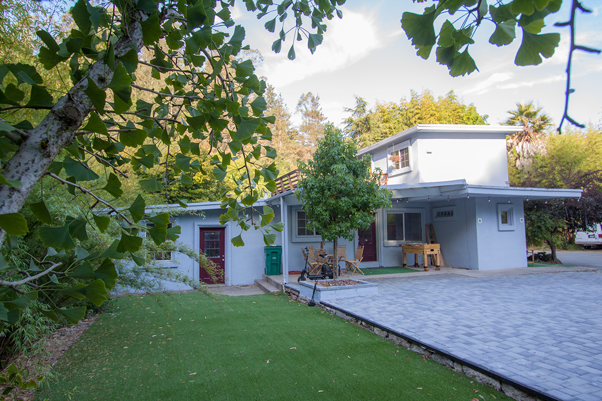 Apartment entry to the right; center door is nursery office; left door is flexible shop space.