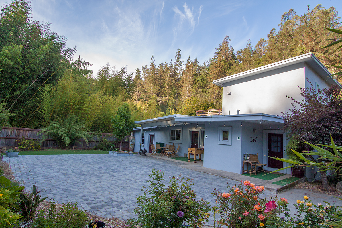 Two-story apartment nestled in a bamboo garden; gated parking outside your door.