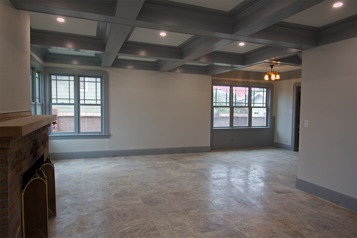 Living room ~15×25 with travertine floors and in-floor radiant heat.