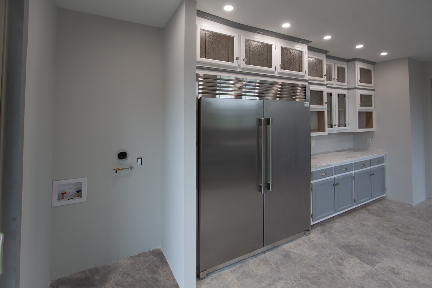 Laundry area for stackable washer & dryer.