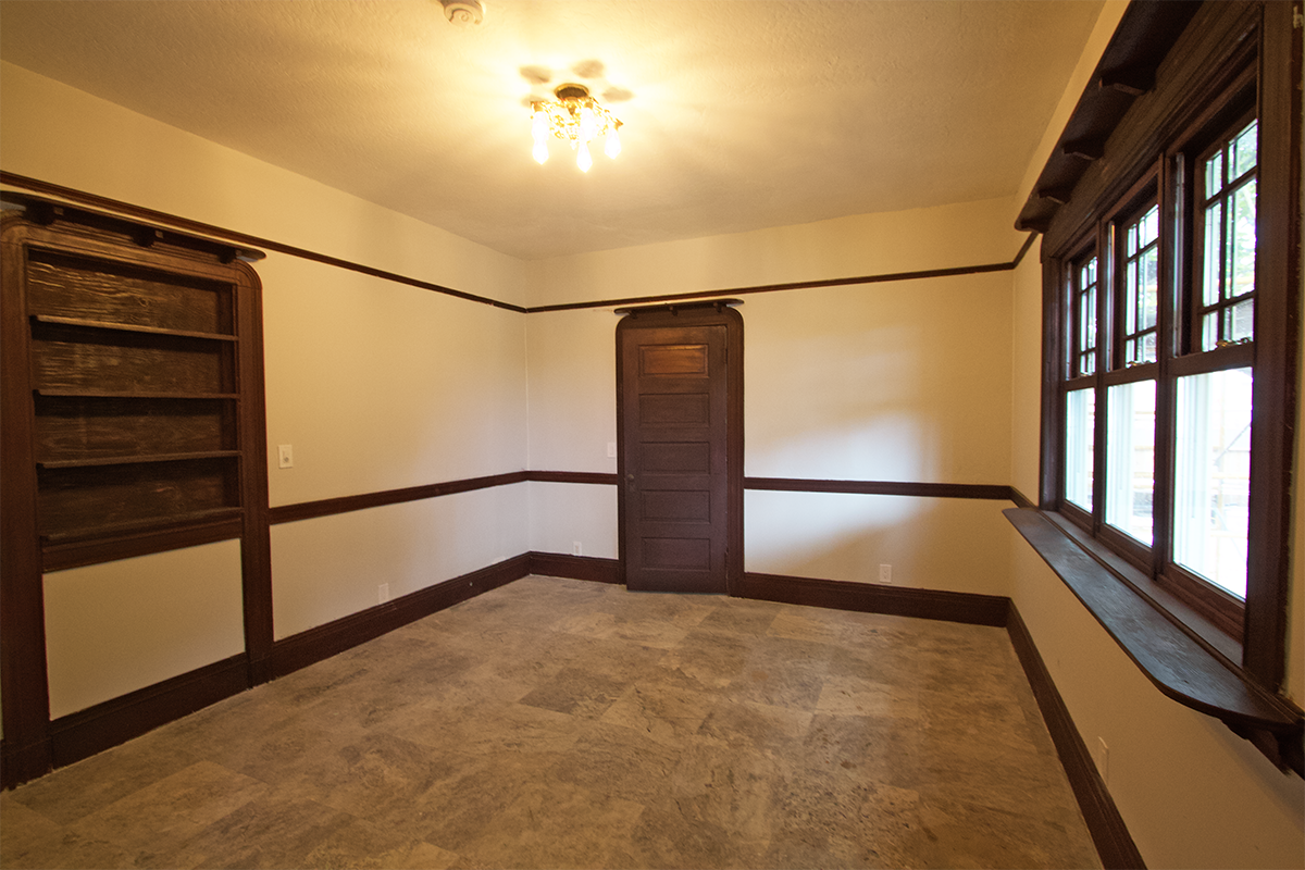 Ground-floor primary bedroom ~12×14 with period trim.