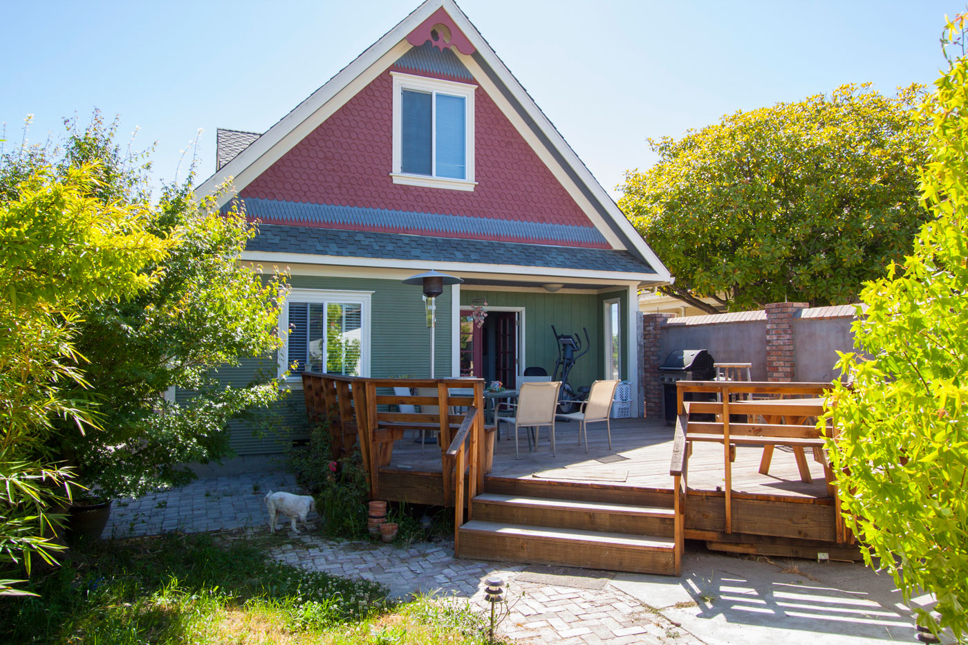 Small enclosed backyard; sprinklers handle most watering.