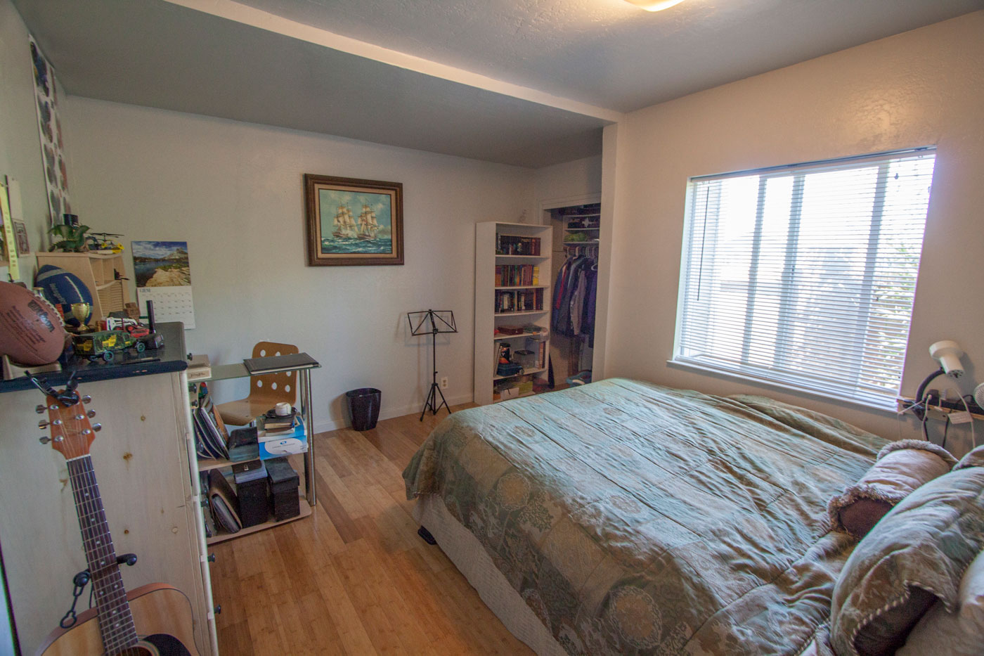 Downstairs “third” bedroom ~11×14 with bamboo floors.