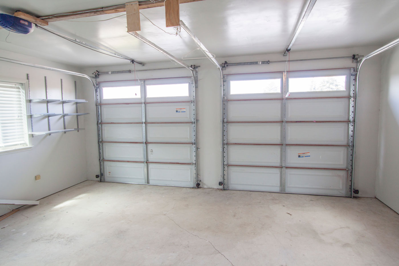 Finished garage used as game room; windows, two auto doors.