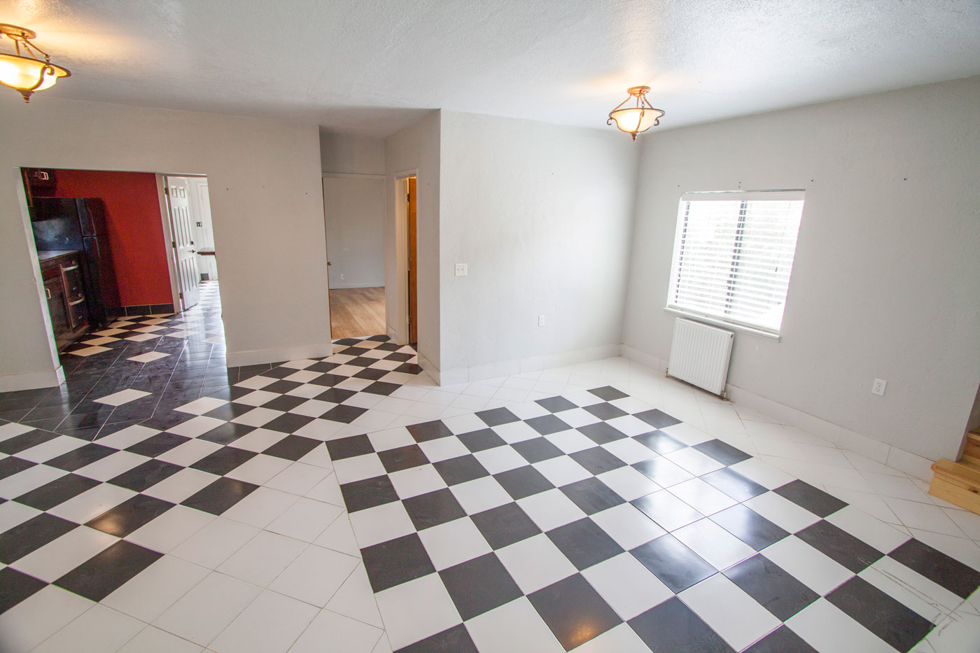 Same entry/living view, unfurnished.