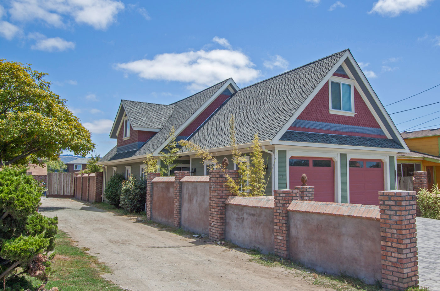 Front exterior with 2-car garage and ample driveway parking.