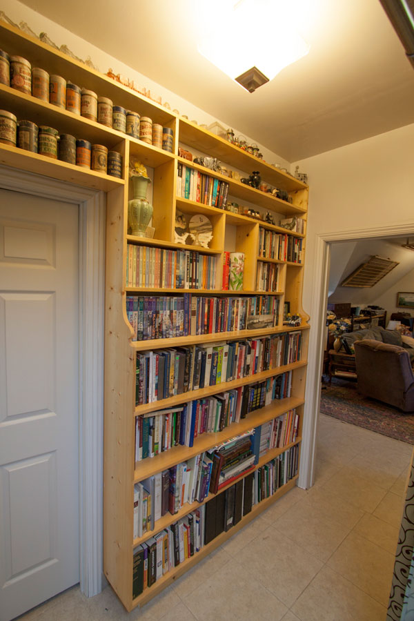 Built-in bookshelf finishing the hall.